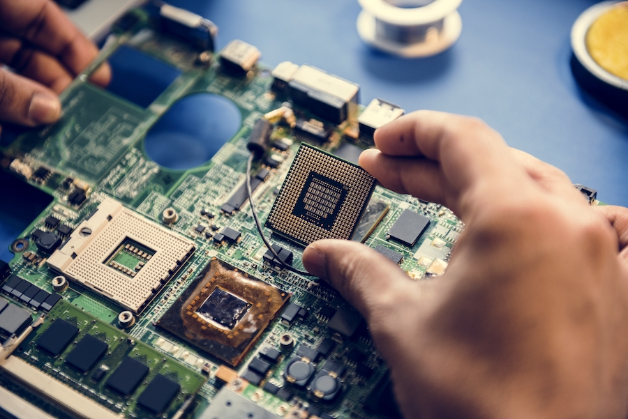 Closeup of hands with computer microprocessor